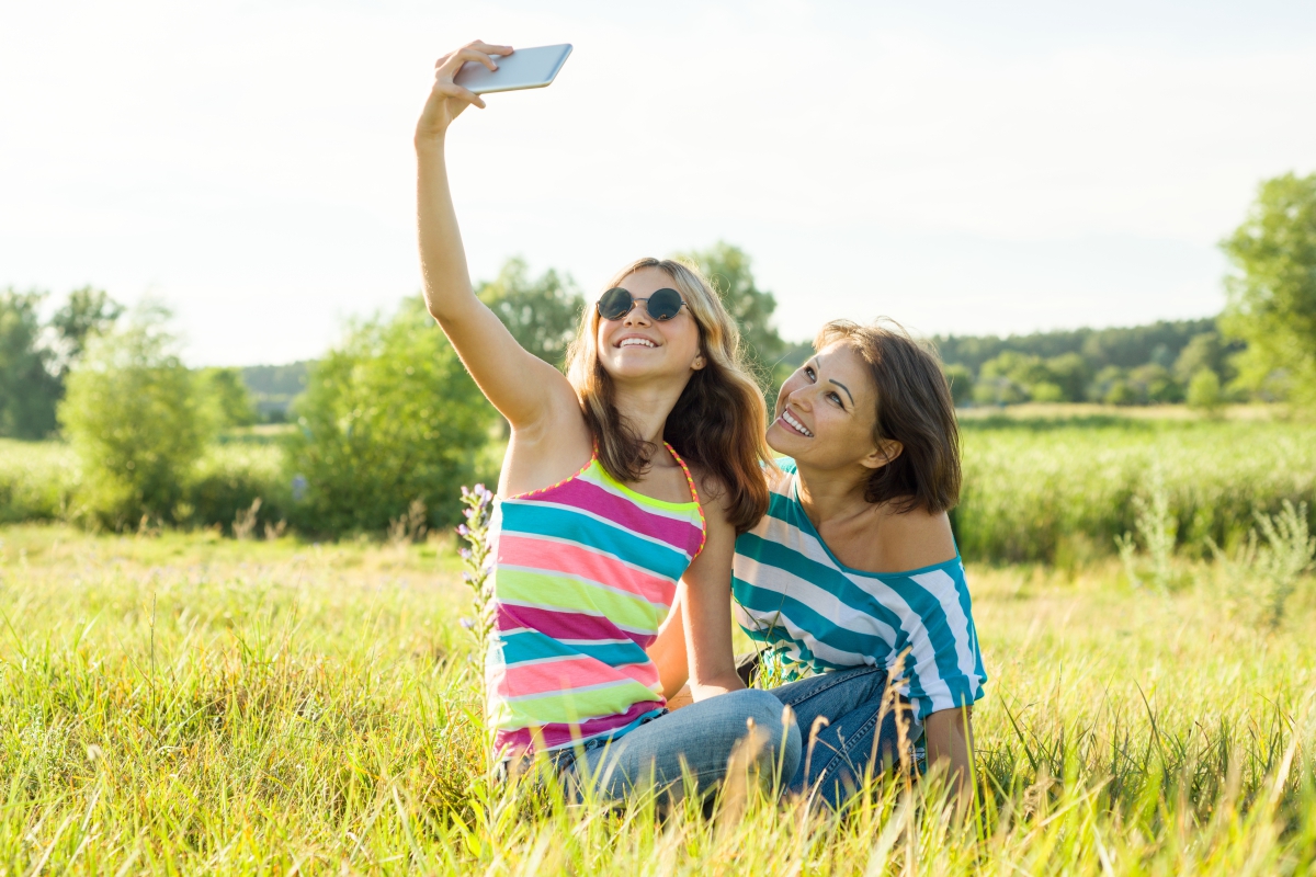 image of mother and daughter taking a selfie